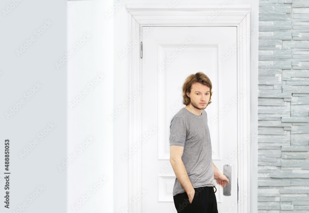 man opening the door of his home. man opening the door of his home.