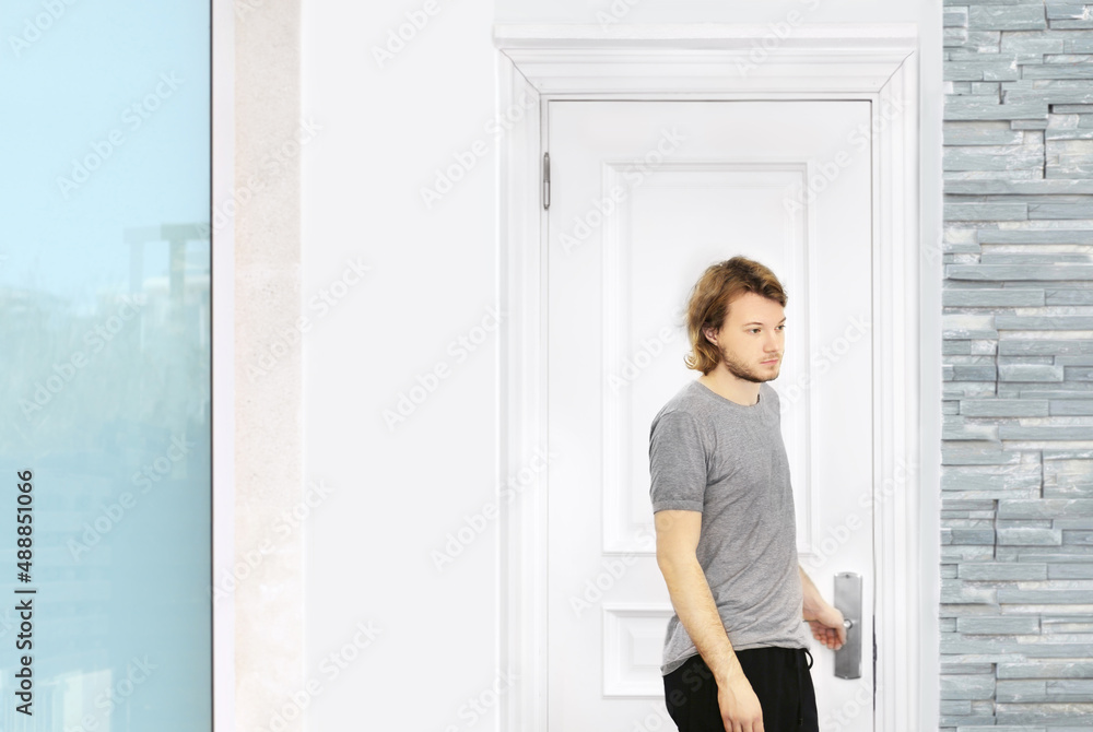 man opening the door of his home. man opening the door of his home.