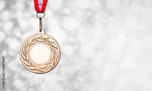 Gold medal of the Olympic Winter Games against the background of snowy nature. photo