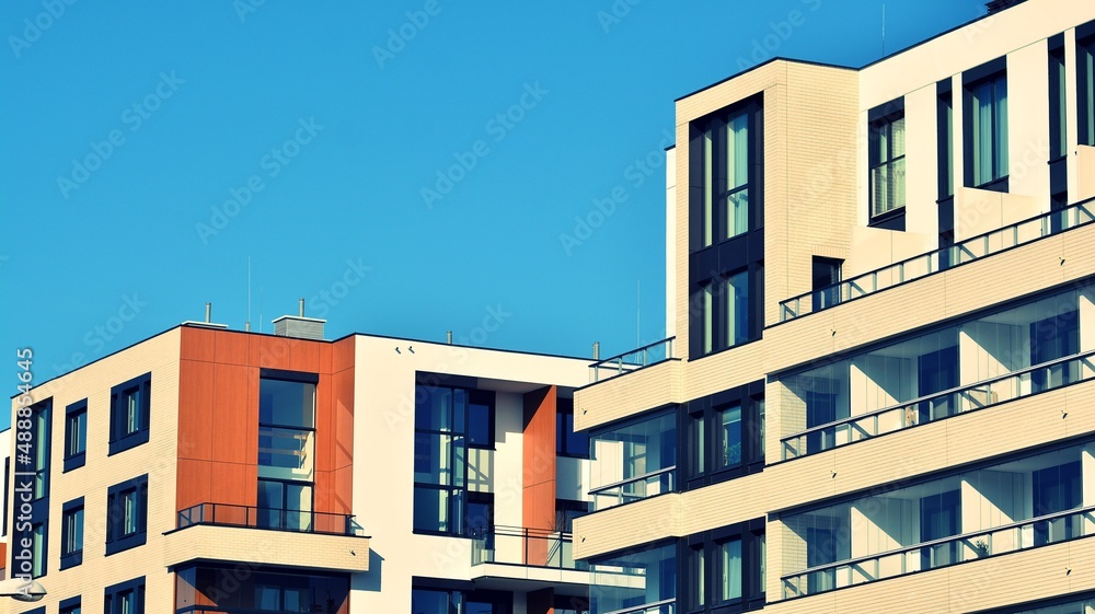 Abstract architecture, fragment of modern urban geometry,. Modern apartment building on a sunny day with a blue sky,. European residential apartment buildings. Cross process photo filter.