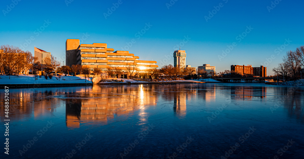 Drone photo landscape at sunset of mirror reflection of downtown skyline in Wichita Kansas in Winter