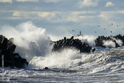 Waves crash on a breakwater during winter storms