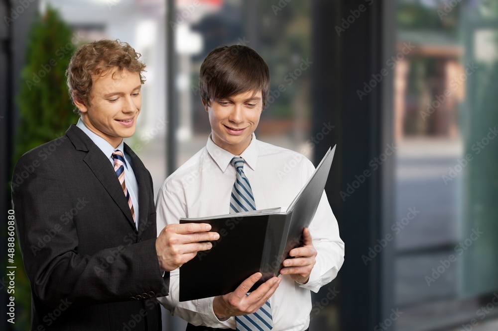 Portrait of successful business people working, in urban background. Portrait of successful business people working, in urban background.