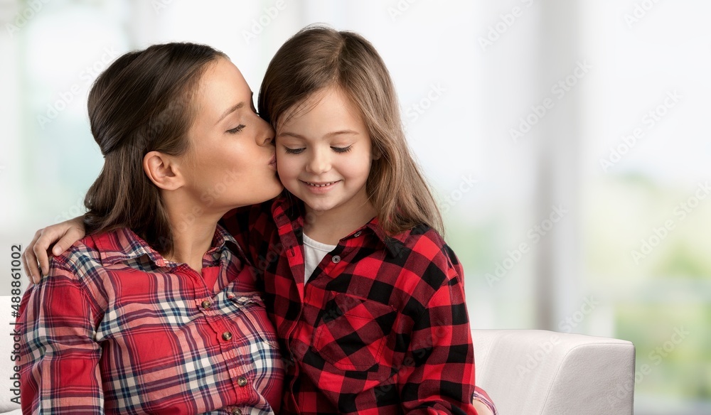 Happy cute little child hugging laughing mom, enjoying leisure with kid, cuddling child. Happy cute little child hugging laughing mom, enjoying leisure with kid, cuddling child.
