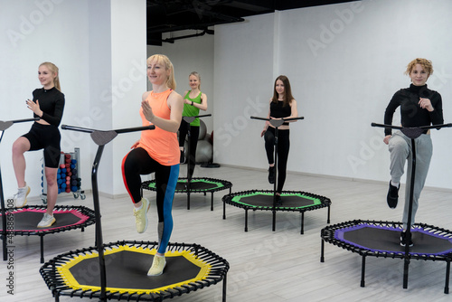 Trampoline for fitness girls are engaged in professional sports, the concept of a healthy lifestyle jumping trampoline woman fitness jump girl, in the afternoon fit equipment in female for fun