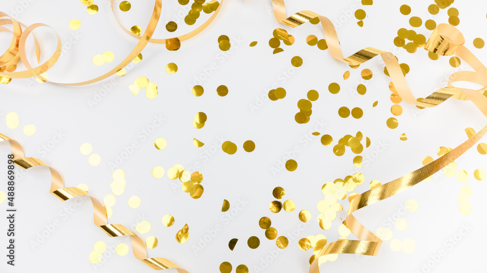 golden confetti on white background flat lay text place . golden confetti on white background flat lay text place .