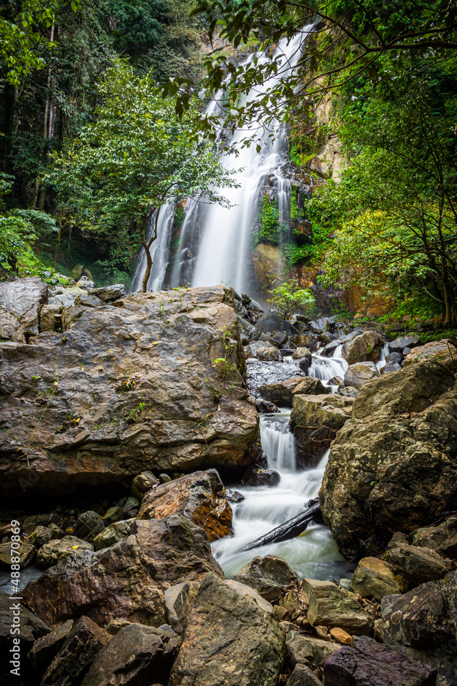 Obraz premium Amazing waterfall in green forest,The terrestrial Halaza Waterfall is in Bang Lang National Park Tham Thalu , Bannang Sata , Yala Thailand