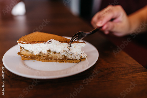 banoffee pie with sprinkled chocolate powder photo