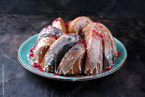 фотографія Traditional exotically bundt marble cocoa chocolate cake with icing sugar glaze