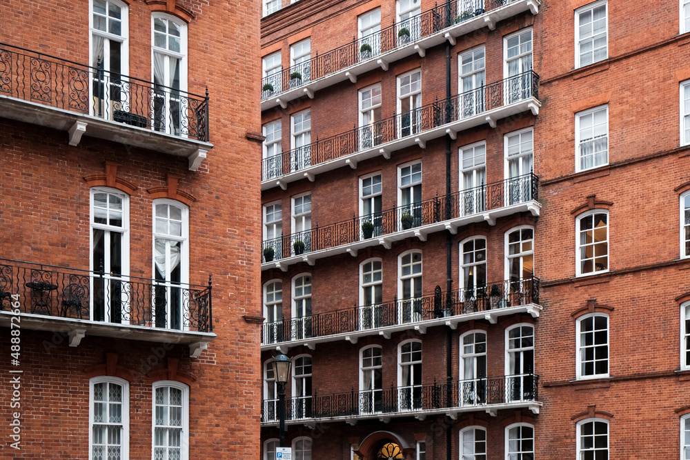 Red Brick Facade of Albert Hall Mansions residential building in Kensington in central London, UK