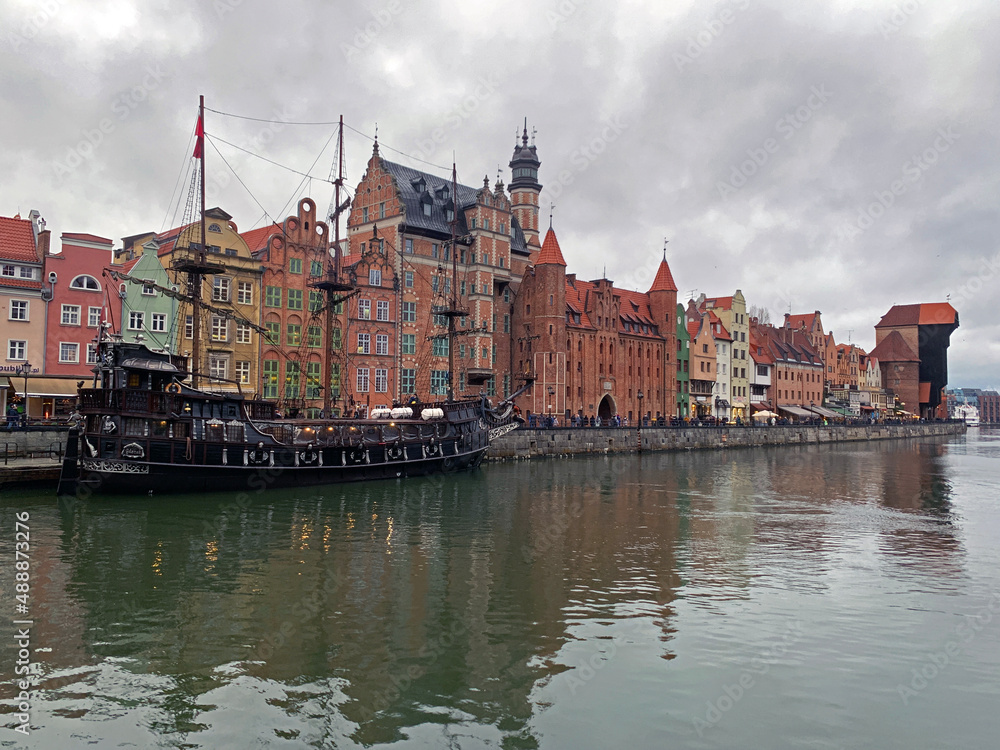 Dramatic picture of the historical buildings of Gdansk on the cold channel
