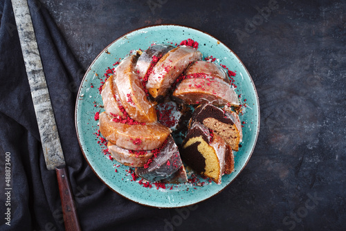 Fotografija Traditional exotically bundt marble cocoa chocolate cake with icing sugar glaze