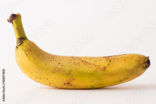 ripe banana sore white table, white background photo