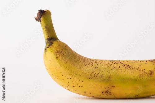 ripe banana sore white table, white background photo