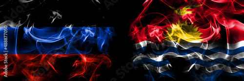 Donetsk People s Republic vs Kiribati flag. Smoke flags placed side by side isolated on black background.