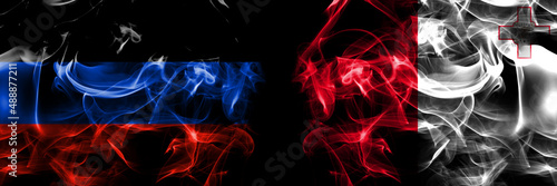Donetsk People s Republic vs Malta  Maltese flag. Smoke flags placed side by side isolated on black background.