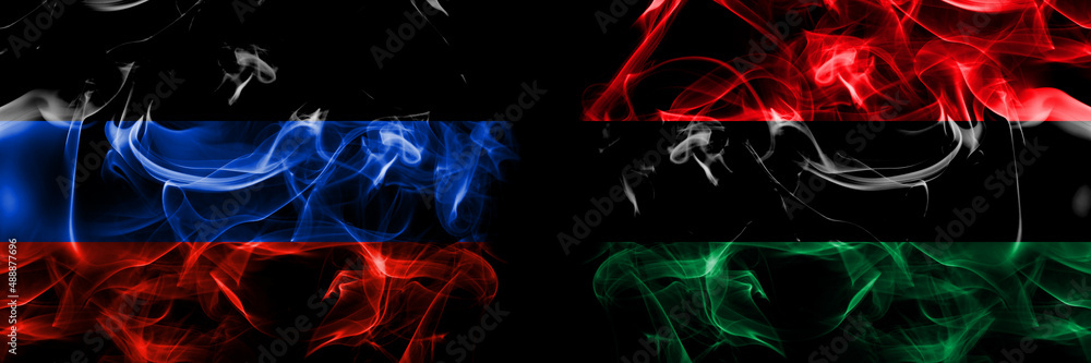 Donetsk People's Republic vs Organizations, Pan african, UNIA flag. Smoke flags placed side by side isolated on black background. - obrazy, fototapety, plakaty 