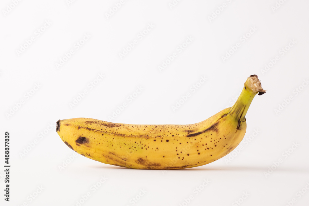 ripe banana sore white table, white background