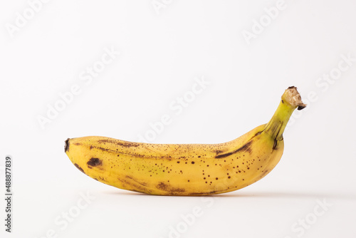 ripe banana sore white table, white background