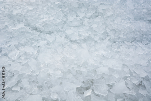 Background from broken pieces of ice. Texture  pattern  closeup