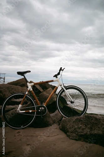 Fototapeta Naklejka Na Ścianę i Meble -  Bike on beach (film 35mm)