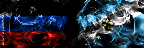 Donetsk People's Republic vs United States of America, America, US, USA, American, Madison, Wisconsin flag. Smoke flags placed side by side isolated on black background. photo