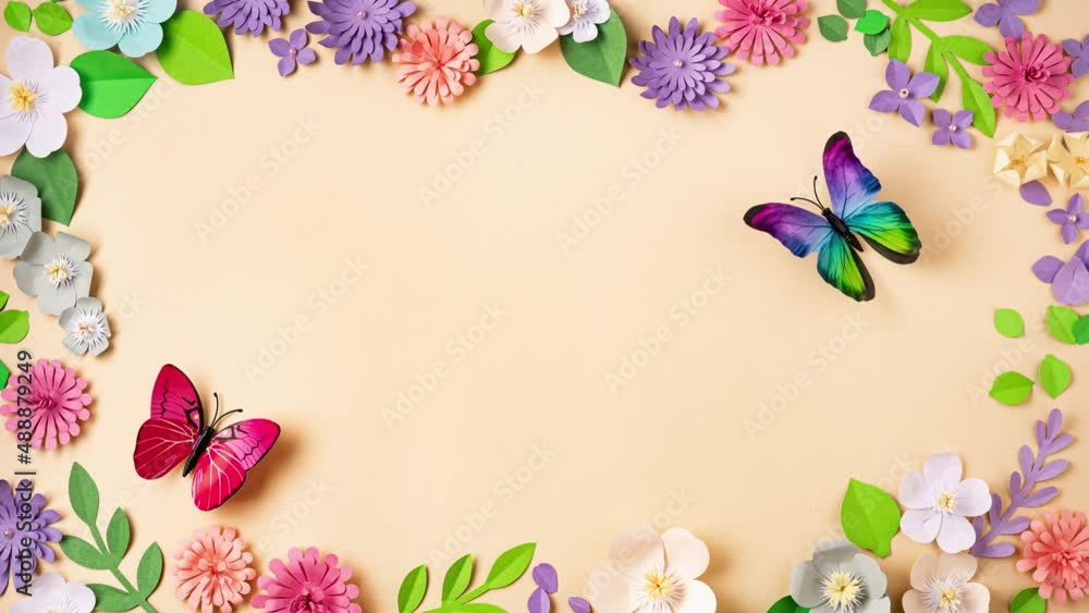Stop motion of floral background with handmade paper flowers and buttreflies. Paper art and handcrafting. Animation. Top view. Spring or summer season. 4K UHD