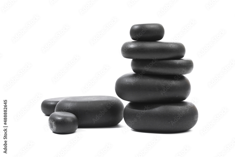 black spa stones isolated on white background . black spa stones isolated on white background .