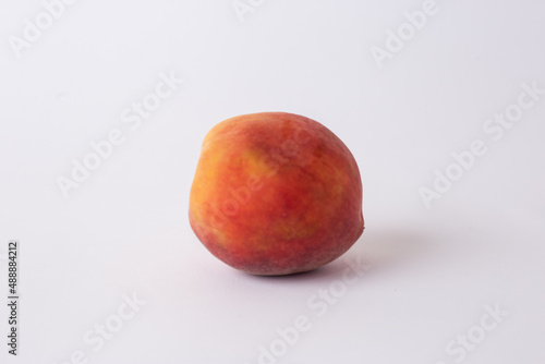 fresh peach on a white meza