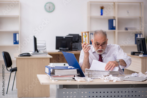Old male employee in time management concept © Elnur