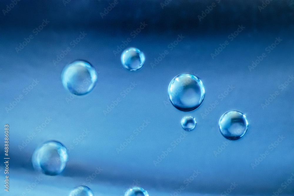 Air bubbles in clear blue water. Cleanliness and hygiene concept.