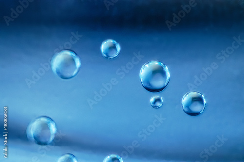 Air bubbles in clear blue water. Cleanliness and hygiene concept.