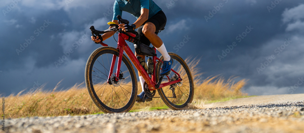 Εκτύπωση καμβά Cyclists practicing on gravel roads  in bad weather day