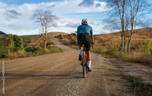 Cyclists practicing on gravel roads © torwaiphoto