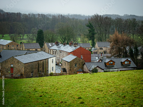Old English village in rainy winter weather 