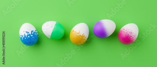 Bunch of colorful eggs on a green Easter background 3D Rendering. Pile of birght and colorful Easter Eggs - 3d render. Easter concept composition frame border photo