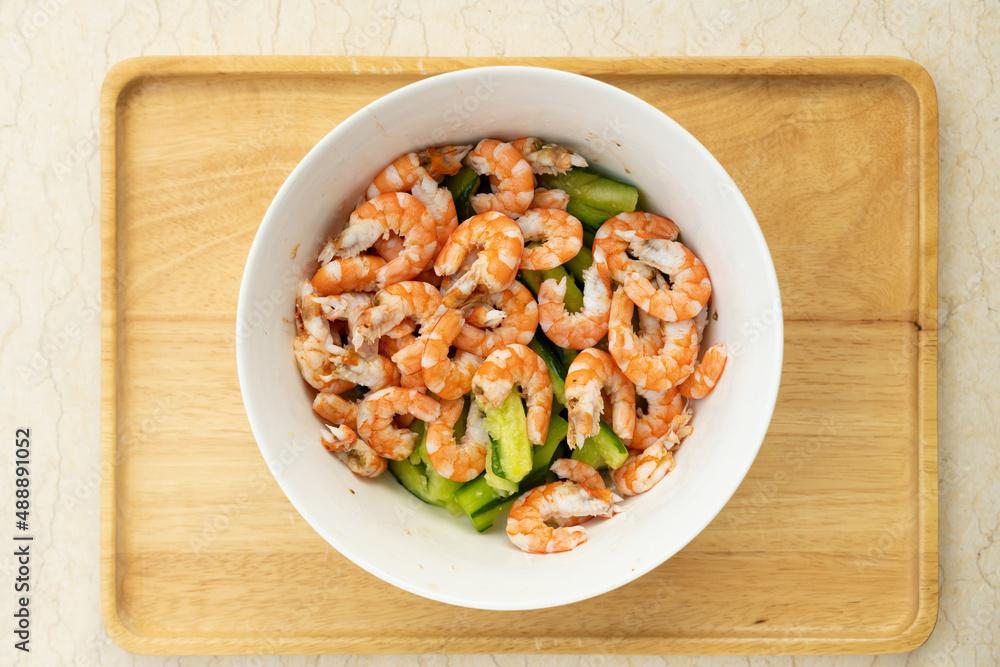 salad made of fresh shrimps and cucumber in a bowl salad made of fresh shrimps and cucumber in a bowl