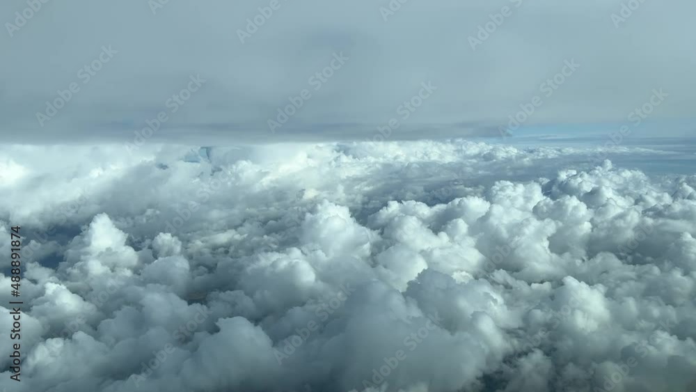 Aerilal view from a cockpit flying between layers of clouds over the Mediterranean Sea Aerilal view from a cockpit flying between layers of clouds over the Mediterranean Sea