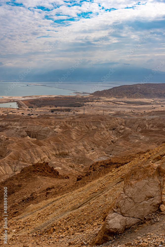 View of the desert mountains and the Dead Sea from an official viewpoint above the Dead Sea in Israel.
View of the desert mountains and the Dead Sea from an official viewpoint above the Dead Sea in Israel.