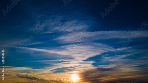 Vibrant beautiful winter sunset with angelic clouds