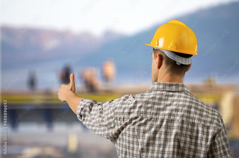 An engineer handsome man or architect looking construction site An engineer handsome man or architect looking construction site