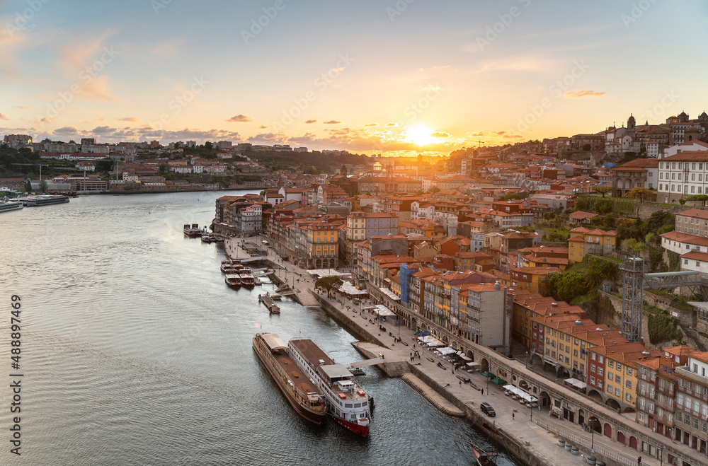 panoramic view of the city of Oporto and the Douro river in Portugal at the sunset.