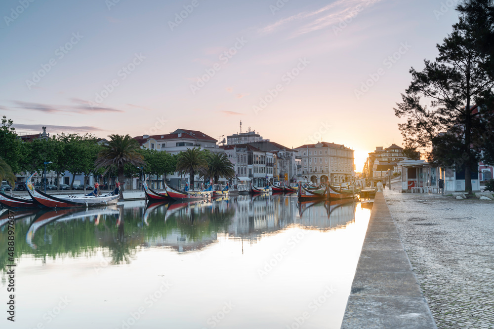 View of the main channel of the Ria de Aveiro in Portugal with the traditional boats Moliceiros