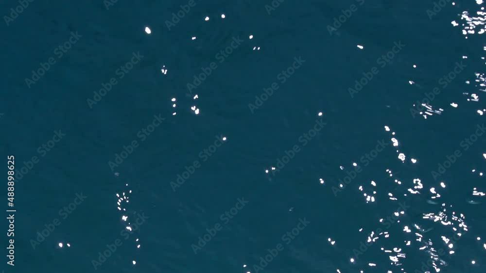 Reflections on moving water. High angle, slow motion. Reflections on moving water. High angle, slow motion.