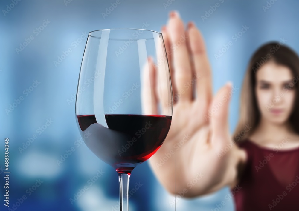 reject liquor, stop alcohol, teenager girl shows a sign of refusal of wine - obrazy, fototapety, plakaty 