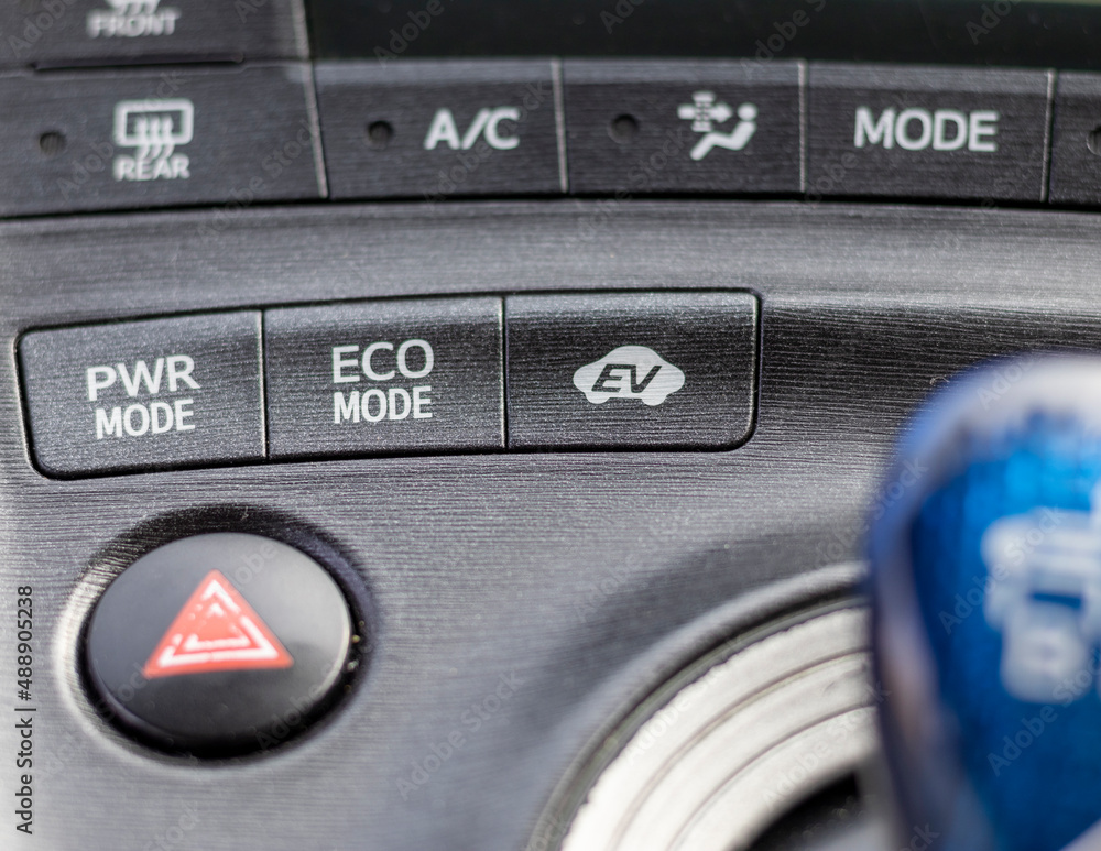 Electric hybrid car center console with various buttons Electric hybrid car center console with various buttons