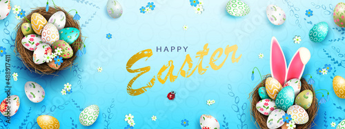Blue composition with Easter eggs in nests, rabbit ears