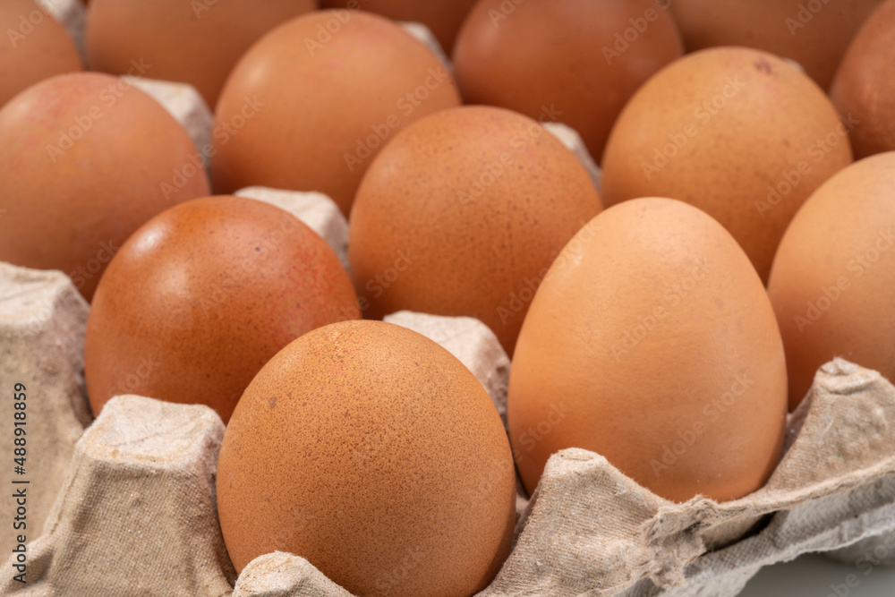 Fresh Chicken eggs in carton box on wooden table. Egg in cardboard box ready to sell. Fresh Chicken eggs in carton box on wooden table. Egg in cardboard box ready to sell.