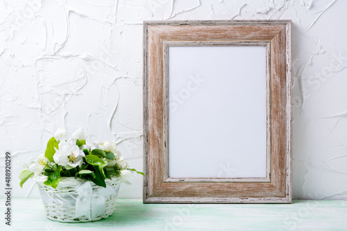 Wooden picture frame mockup with apple tree flowers