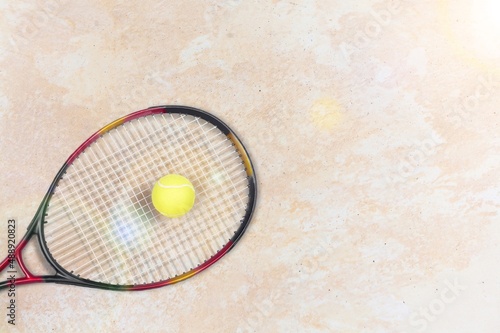 New professional tennis racket and ball on background. Sport theme © BillionPhotos.com